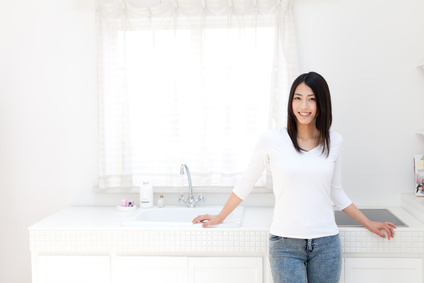 a young asian woman in the kitchen