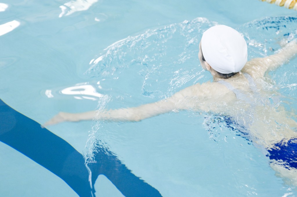 woman swimming in swimming pool